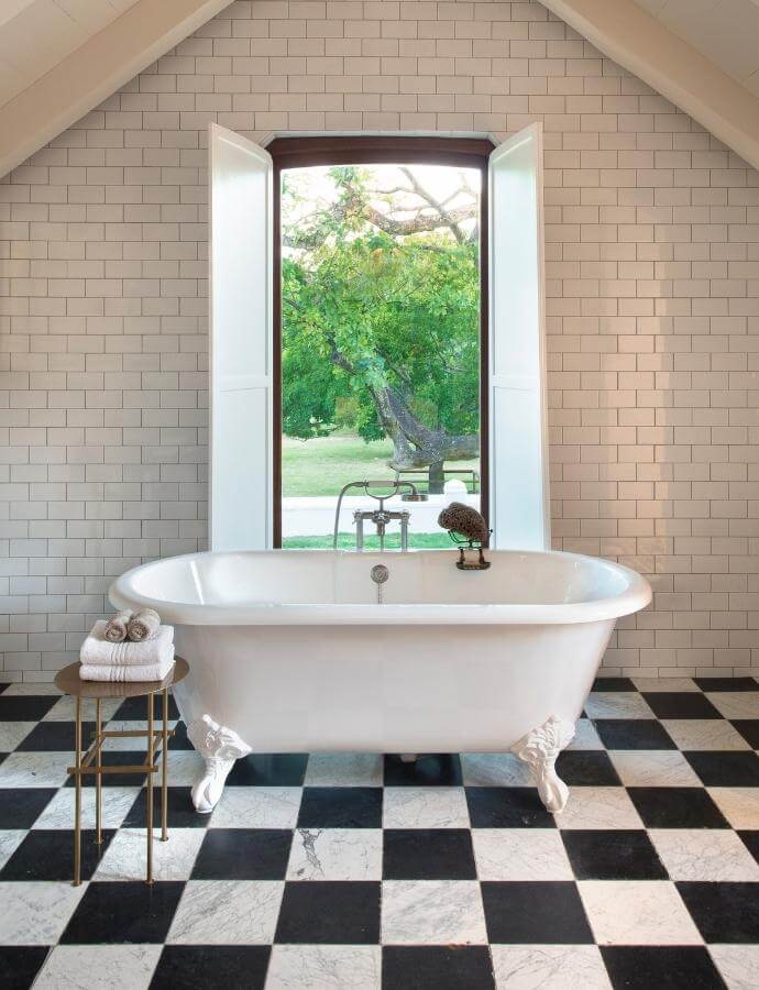 Inspirational mood board showing traditional bathroom products with a freestanding bath & monochrome tiles